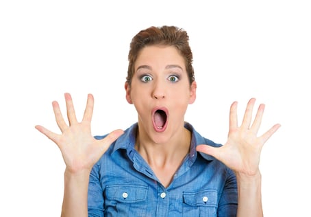 Closeup portrait of happy cute young beautiful woman looking shocked surprised in full disbelief hands in air, screaming isolated on white background. Positive human emotion facial expression feelings