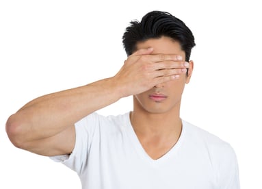 Closeup portrait of young man, closing, covering blind eyes with hands cant see, hiding, avoiding situation, isolated on white background. See no evil concept. Human emotions, facial expressions