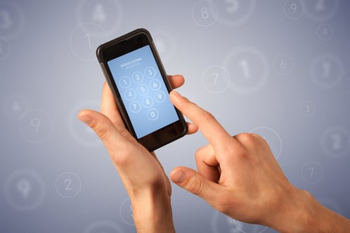 Female fingers touching smartphone with locked device requiring passcode